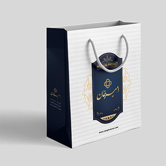 ساک دستی کاغذی گلاسه با چاپ طلاکوب برند امیرخان